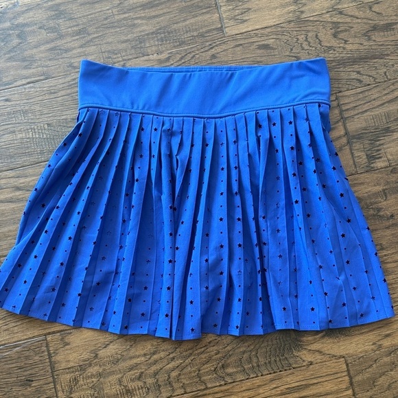 Thrive Societe Dresses & Skirts - T/S by Thrive Royal Blue Cutout pleated star athletic skirt